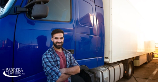Man leaning against an 18-wheeler